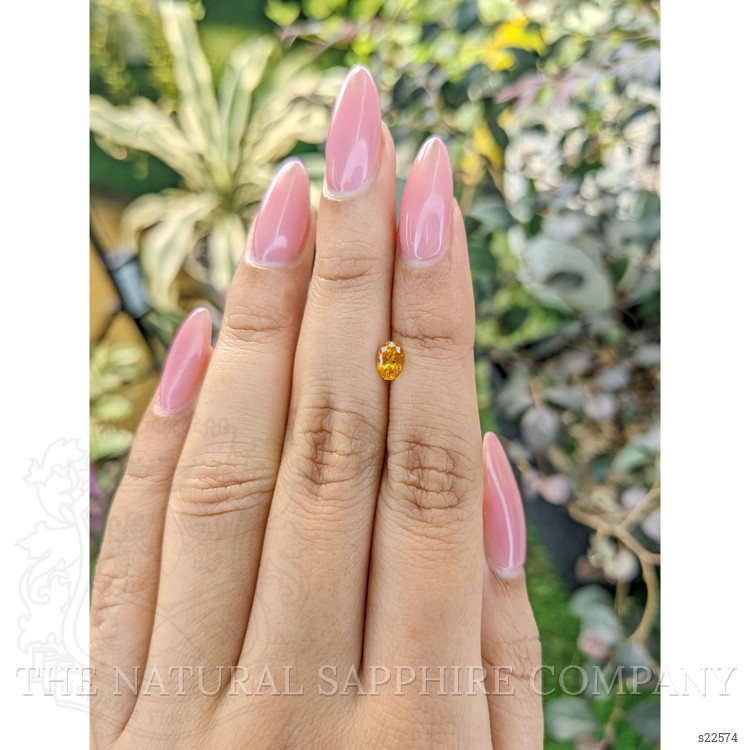 0.51 Ct. Orangish Yellow Sapphire from Ceylon (Sri Lanka)