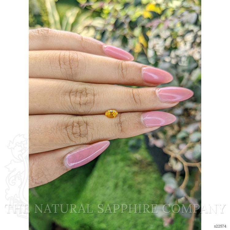 0.51 Ct. Orangish Yellow Sapphire from Ceylon (Sri Lanka)