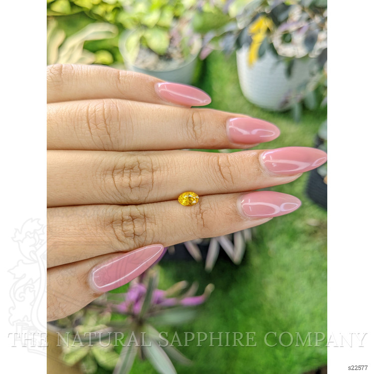 0.60 Ct. Orangish Yellow Sapphire from Ceylon (Sri Lanka)