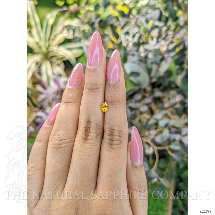 0.60 Ct. Orangish Yellow Sapphire from Ceylon (Sri Lanka)