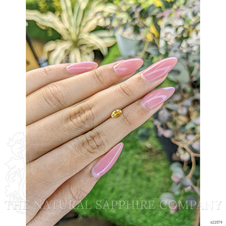 0.43 Ct. Orangish Yellow Sapphire from Ceylon (Sri Lanka)