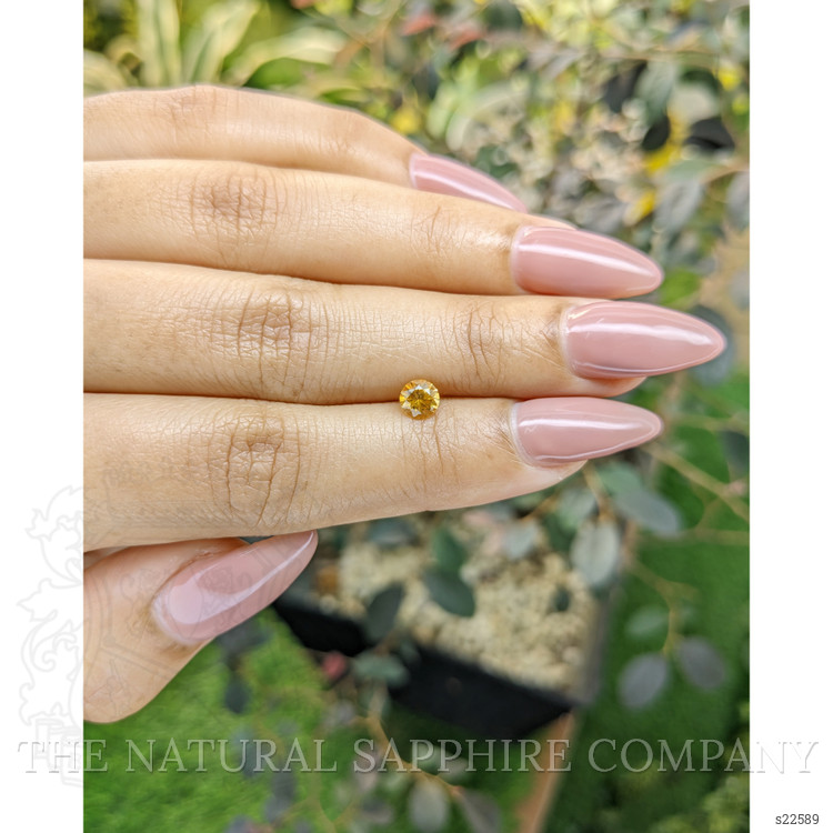 0.56 Ct. Orangish Yellow Sapphire from Ceylon (Sri Lanka)