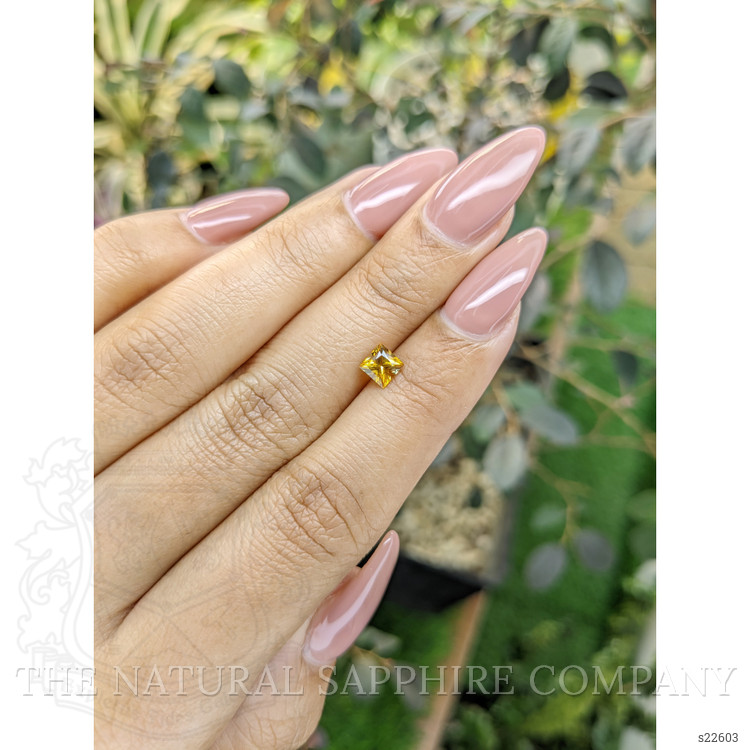 0.63 Ct. Orangish Yellow Sapphire from Ceylon (Sri Lanka)