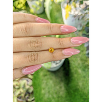 0.65 Ct. Orangish Yellow Sapphire from Ceylon (Sri Lanka) Life Style