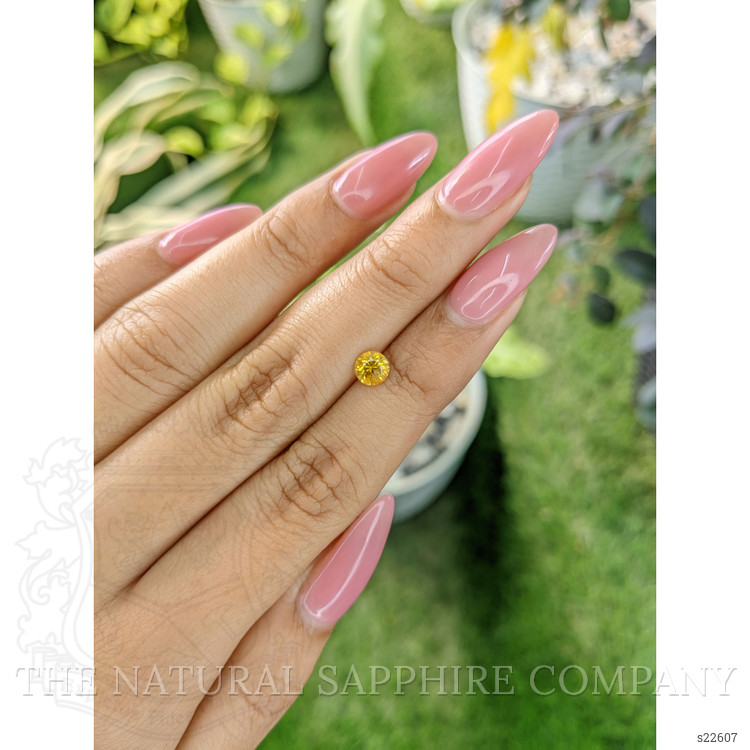 0.66 Ct. Orangish Yellow Sapphire from Ceylon (Sri Lanka)