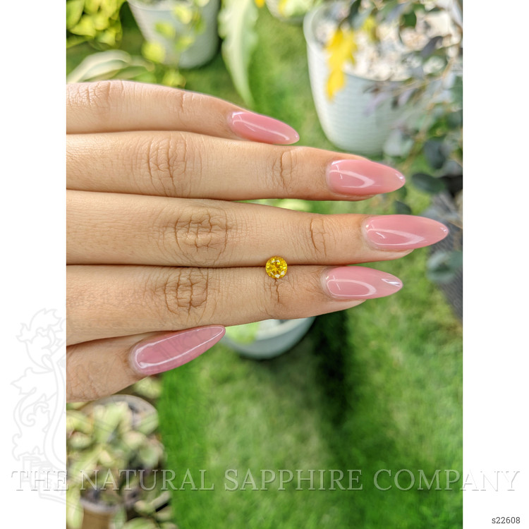 0.55 Ct. Orangish Yellow Sapphire from Ceylon (Sri Lanka)