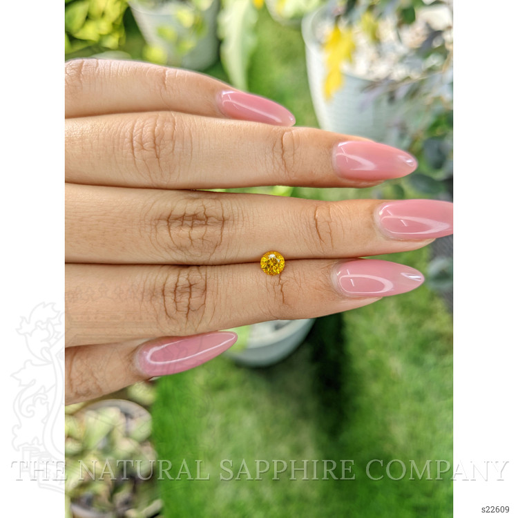 0.55 Ct. Orangish Yellow Sapphire from Ceylon (Sri Lanka)