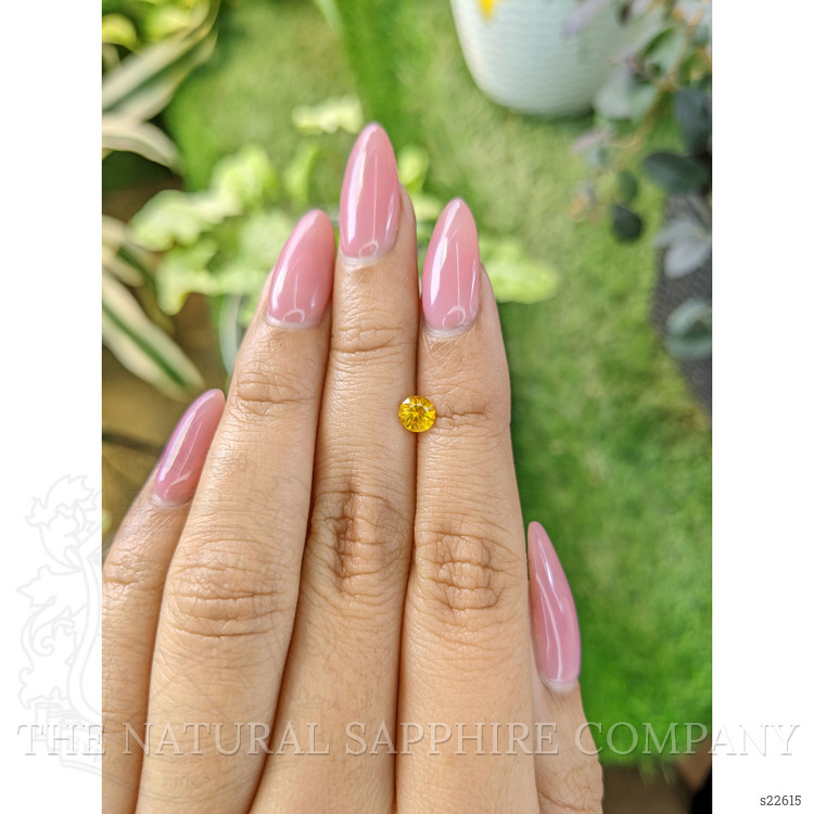 0.53 Ct. Orangish Yellow Sapphire from Ceylon (Sri Lanka)