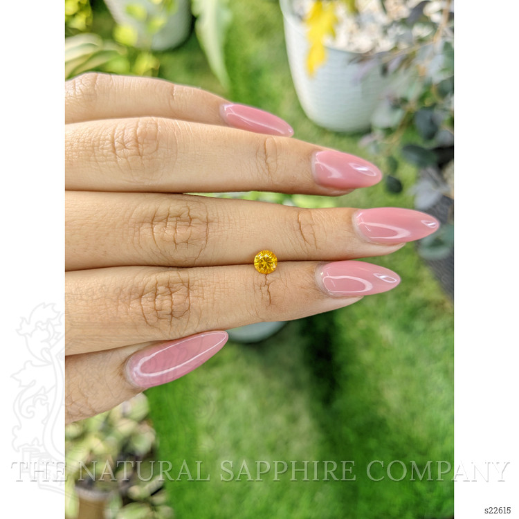 0.53 Ct. Orangish Yellow Sapphire from Ceylon (Sri Lanka)