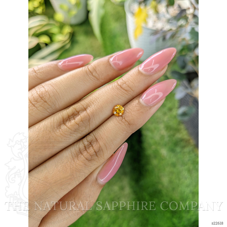 0.61 Ct. Orangish Yellow Sapphire from Ceylon (Sri Lanka)