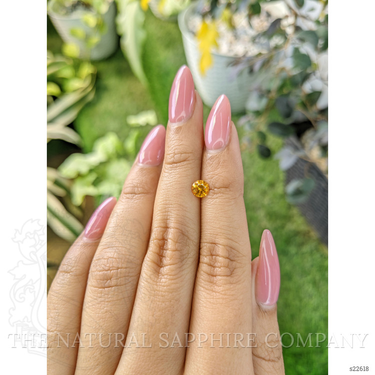 0.61 Ct. Orangish Yellow Sapphire from Ceylon (Sri Lanka)