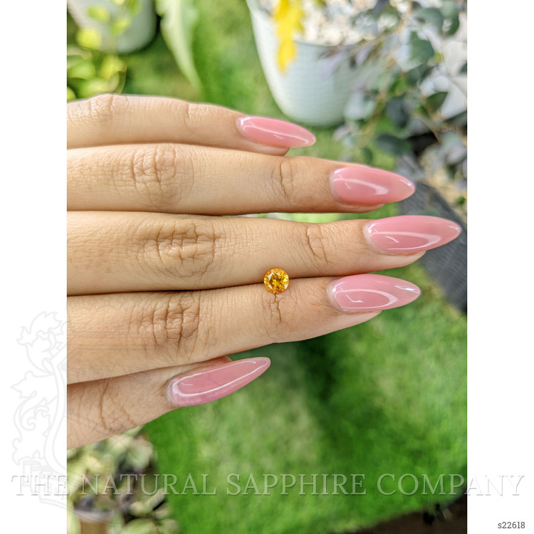 0.61 Ct. Orangish Yellow Sapphire from Ceylon (Sri Lanka)