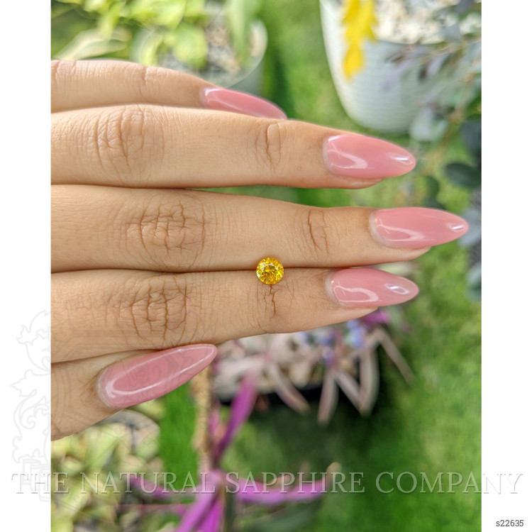 0.65 Ct. Orangish Yellow Sapphire from Ceylon (Sri Lanka)