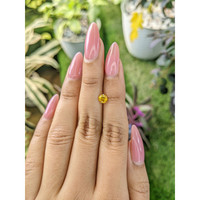 0.65 Ct. Orangish Yellow Sapphire from Ceylon (Sri Lanka) Life Style