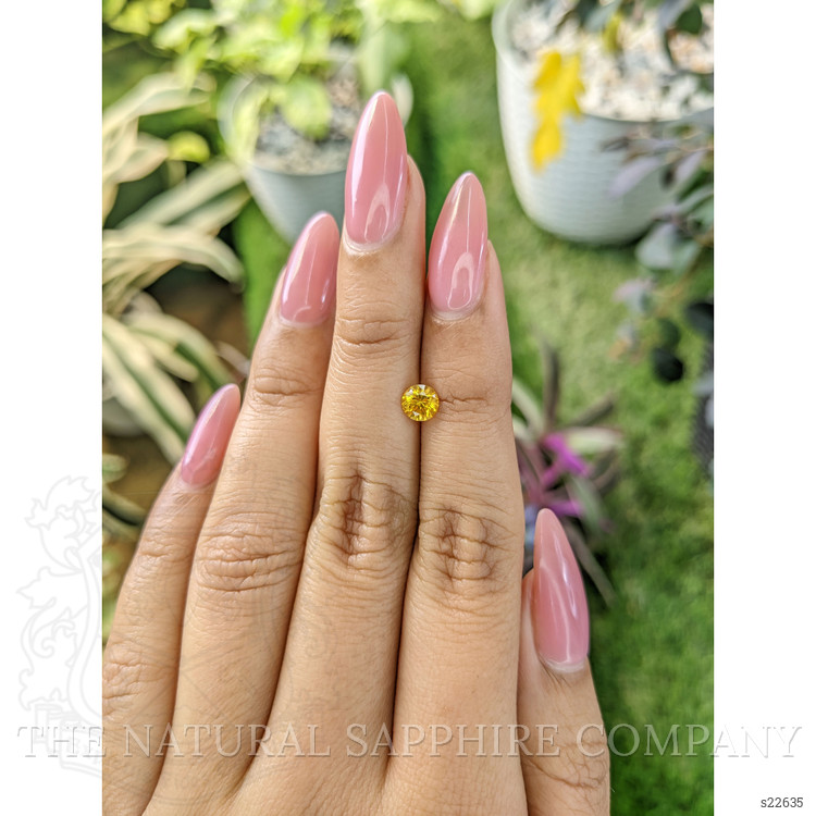0.65 Ct. Orangish Yellow Sapphire from Ceylon (Sri Lanka)