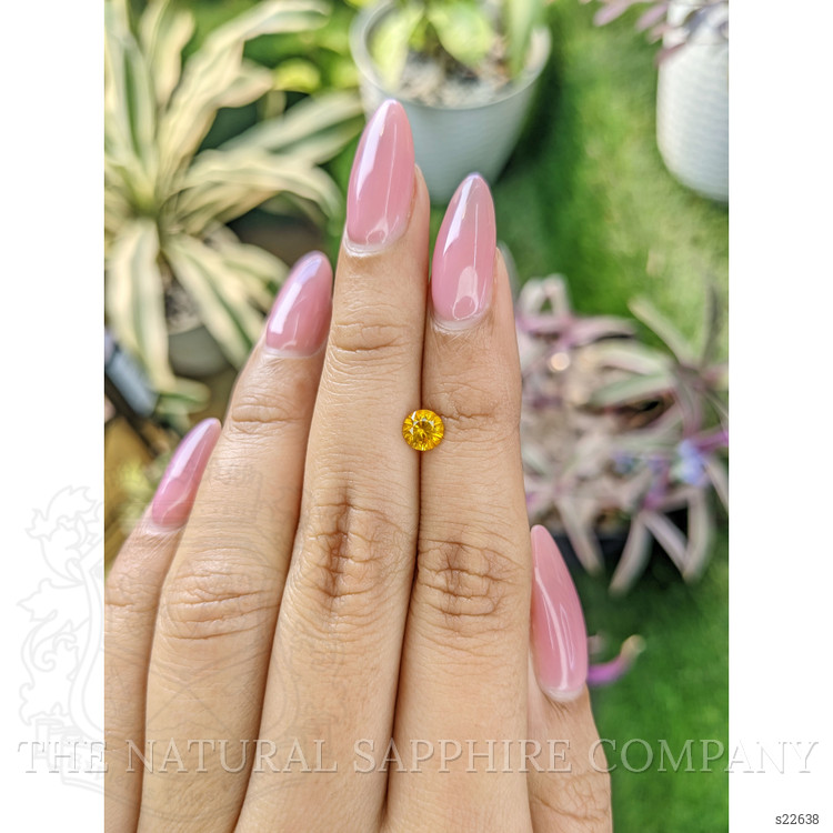 0.65 Ct. Yellowish Orange Sapphire from Ceylon (Sri Lanka)