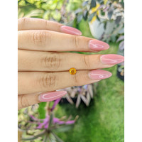 0.65 Ct. Yellowish Orange Sapphire from Ceylon (Sri Lanka) Life Style