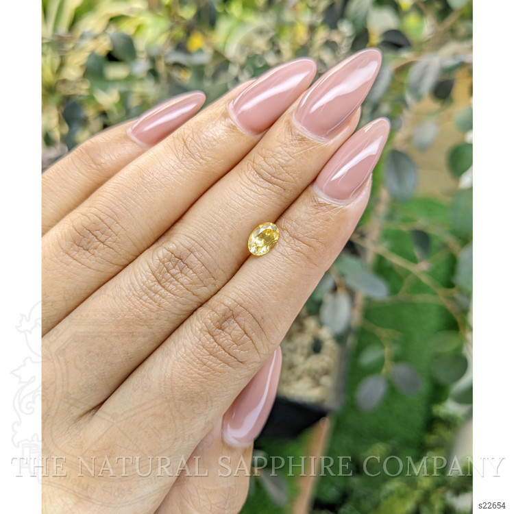 0.95 Ct. Orangish Yellow Sapphire from Ceylon (Sri Lanka)