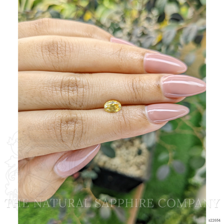 0.95 Ct. Orangish Yellow Sapphire from Ceylon (Sri Lanka)