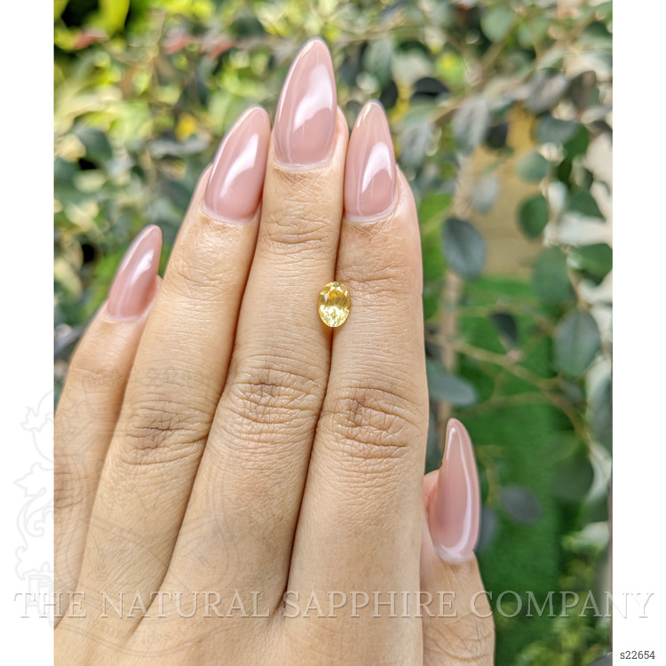 0.95 Ct. Orangish Yellow Sapphire from Ceylon (Sri Lanka)