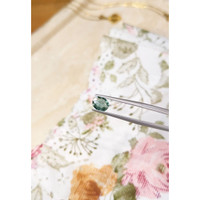 0.97 Ct. Bluish Green Sapphire from Madagascar Life Style