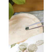 0.66 Ct. Bluish Green Sapphire from Madagascar Life Style