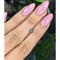 0.61 Ct. Bluish Green Sapphire from Madagascar Life Style