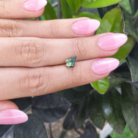 1.55 Ct. Bluish Green Sapphire from Madagascar Life Style