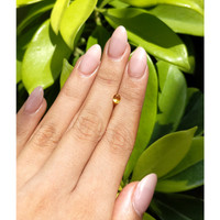 0.49 Ct. Orangish Yellow Sapphire from Ceylon (Sri Lanka) Life Style