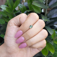 0.95 Ct. Bluish Green Sapphire from Madagascar Life Style