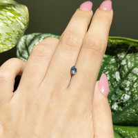 0.65 Ct. Bluish Green Sapphire from Madagascar Life Style