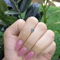 0.65 Ct. Bluish Green Sapphire from Madagascar Life Style