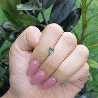 0.84 Ct. Bluish Green Sapphire from Madagascar Life Style