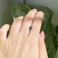 0.84 Ct. Bluish Green Sapphire from Madagascar Life Style