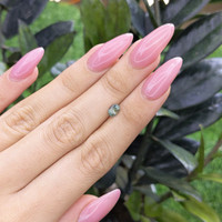 0.78 Ct. Bluish Green Sapphire from Madagascar Life Style