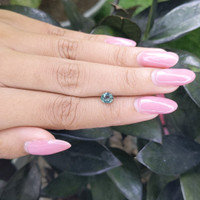 0.92 Ct. Bluish Green Sapphire from Madagascar Life Style