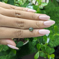 1.03 Ct. Yellowish Green Sapphire from Madagascar Life Style
