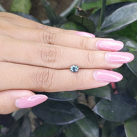 0.83 Ct. Bluish Green Sapphire from Madagascar Life Style