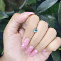 0.83 Ct. Bluish Green Sapphire from Madagascar Life Style