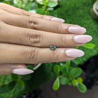 0.79 Ct. Bluish Green Sapphire from Madagascar Life Style