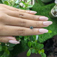 0.95 Ct. Bluish Green Sapphire from Madagascar Life Style