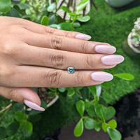 0.76 Ct. Bluish Green Sapphire from Madagascar Life Style
