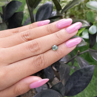 1.02 Ct. Bluish Green Sapphire from Madagascar Life Style