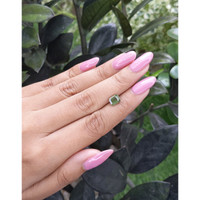 1.56 Ct. Yellowish Green Sapphire from Madagascar Life Style