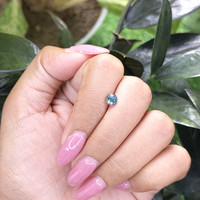 0.72 Ct. Greenish Blue Sapphire from Madagascar Life Style