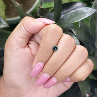 0.46 Ct. Bluish Green Sapphire from Madagascar Life Style