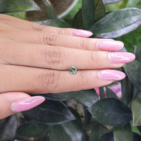 0.47 Ct. Yellowish Green Sapphire from Madagascar Life Style