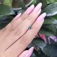 0.45 Ct. Bluish Green Sapphire from Madagascar Life Style