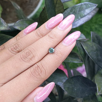 0.78 Ct. Bluish Green Sapphire from Madagascar Life Style