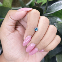 0.55 Ct. Bluish Green Sapphire from Madagascar Life Style